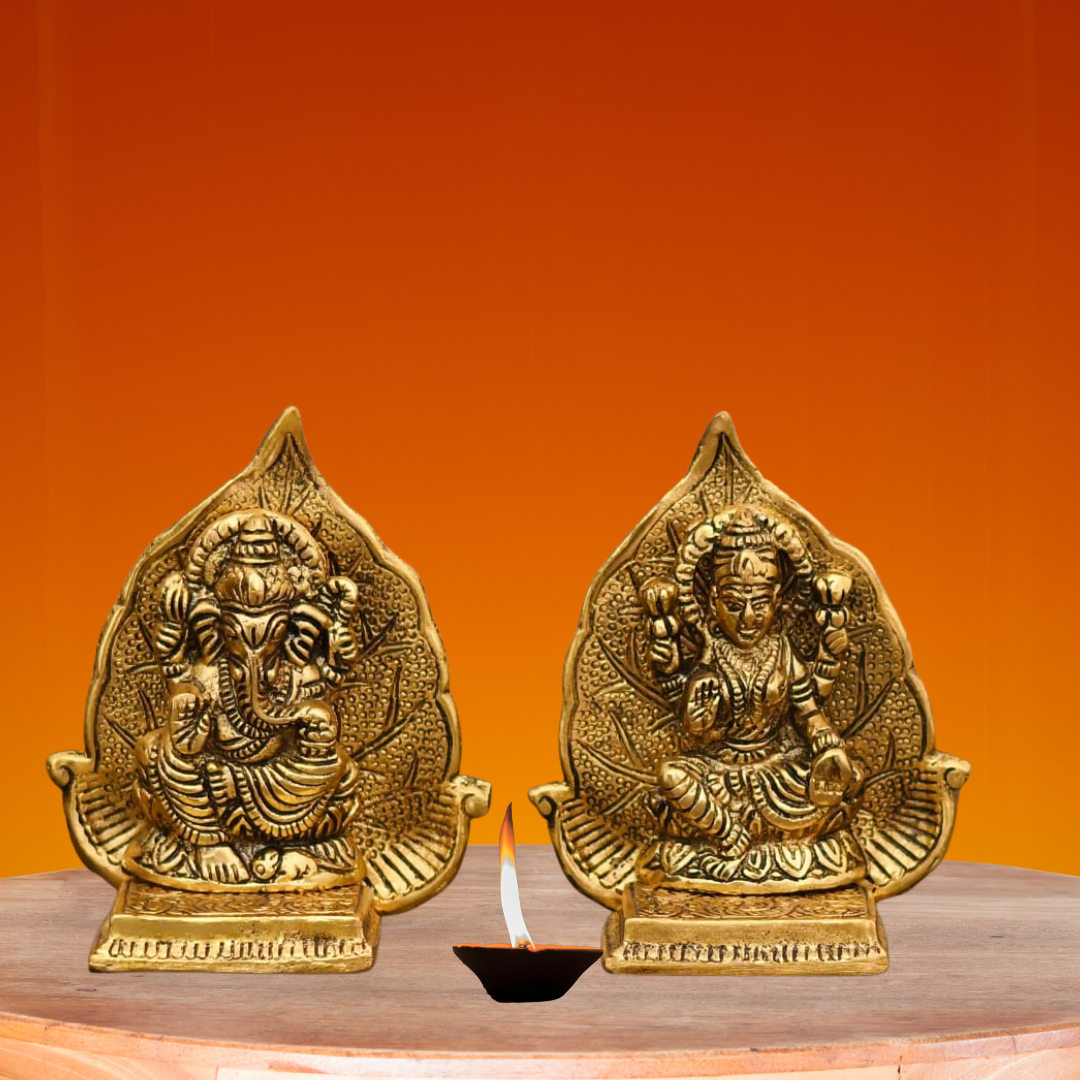 Lord Ganesh And Maa Laxmi Seat On Leaf