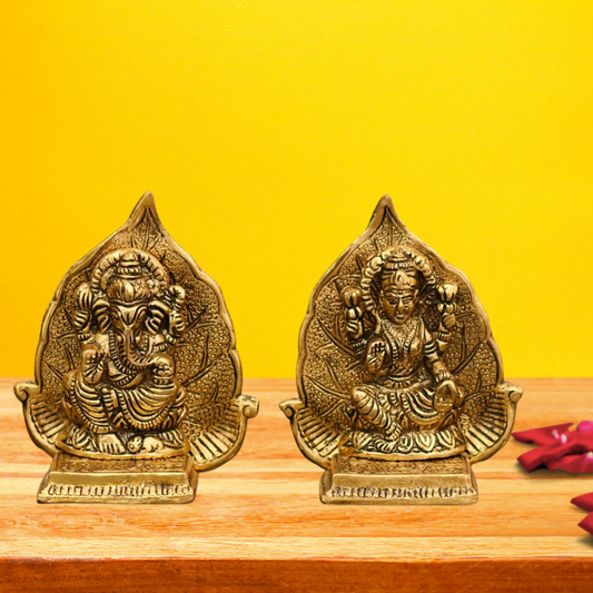 Lord Ganesh And Maa Laxmi Seat On Leaf