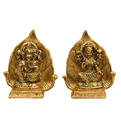 Lord Ganesh And Maa Laxmi Seat On Leaf